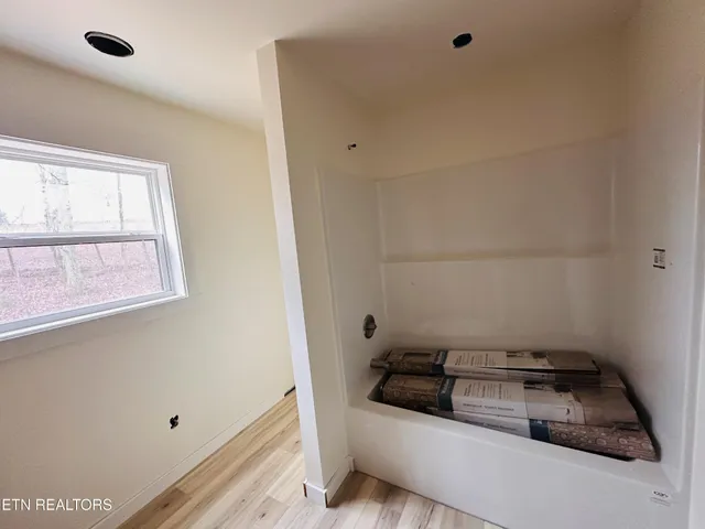 a bathroom with a sink and a window