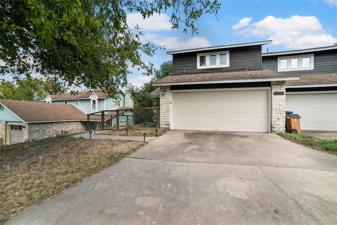 2009 Kenneth Avenue, Unit A Austin, TX 78741 - Photo 15 of 17 a front view of a house with garage