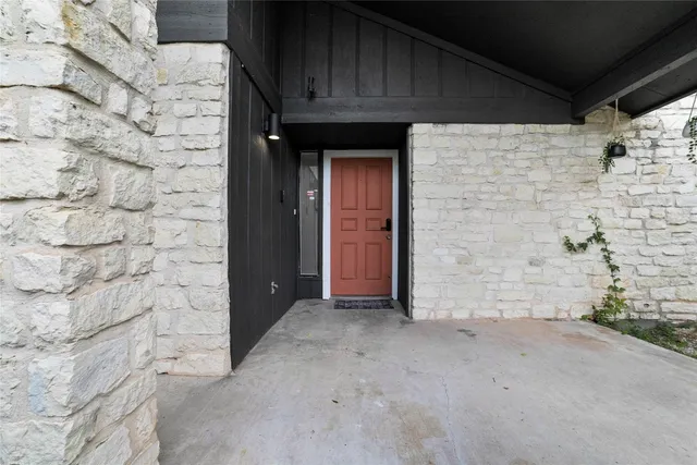 a view of a wooden door of the house