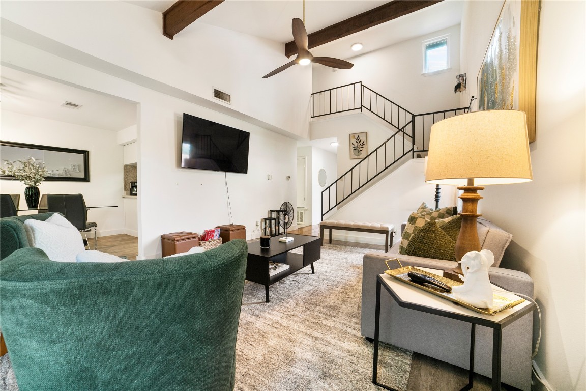 2009 Kenneth Avenue, Unit A Austin, TX 78741 - Photo 2 of 17 a living room with fireplace furniture and a flat screen tv