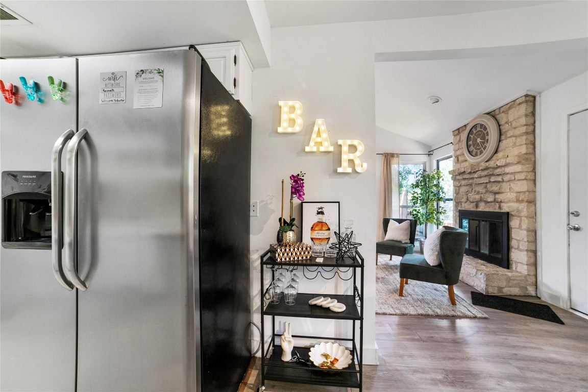 2009 Kenneth Avenue, Unit A Austin, TX 78741 - Photo 5 of 17 a kitchen with furniture and a refrigerator