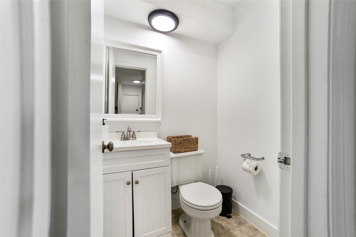 2009 Kenneth Avenue, Unit A Austin, TX 78741 - Photo 10 of 17 a bathroom with a toilet sink and mirror