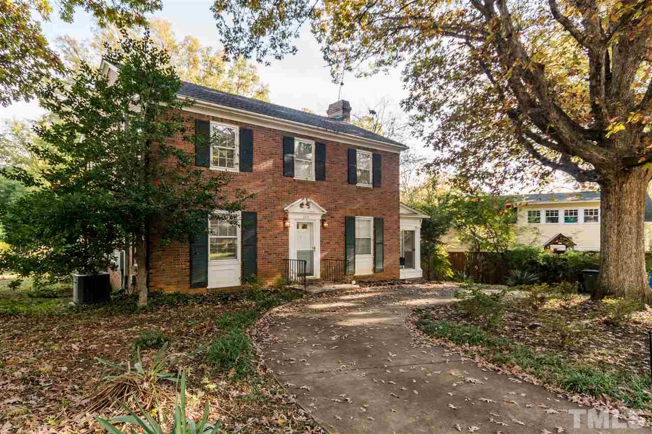 509 Burton Street Raleigh, NC 27608 - Photo 1 of 25 a front view of a house with a yard