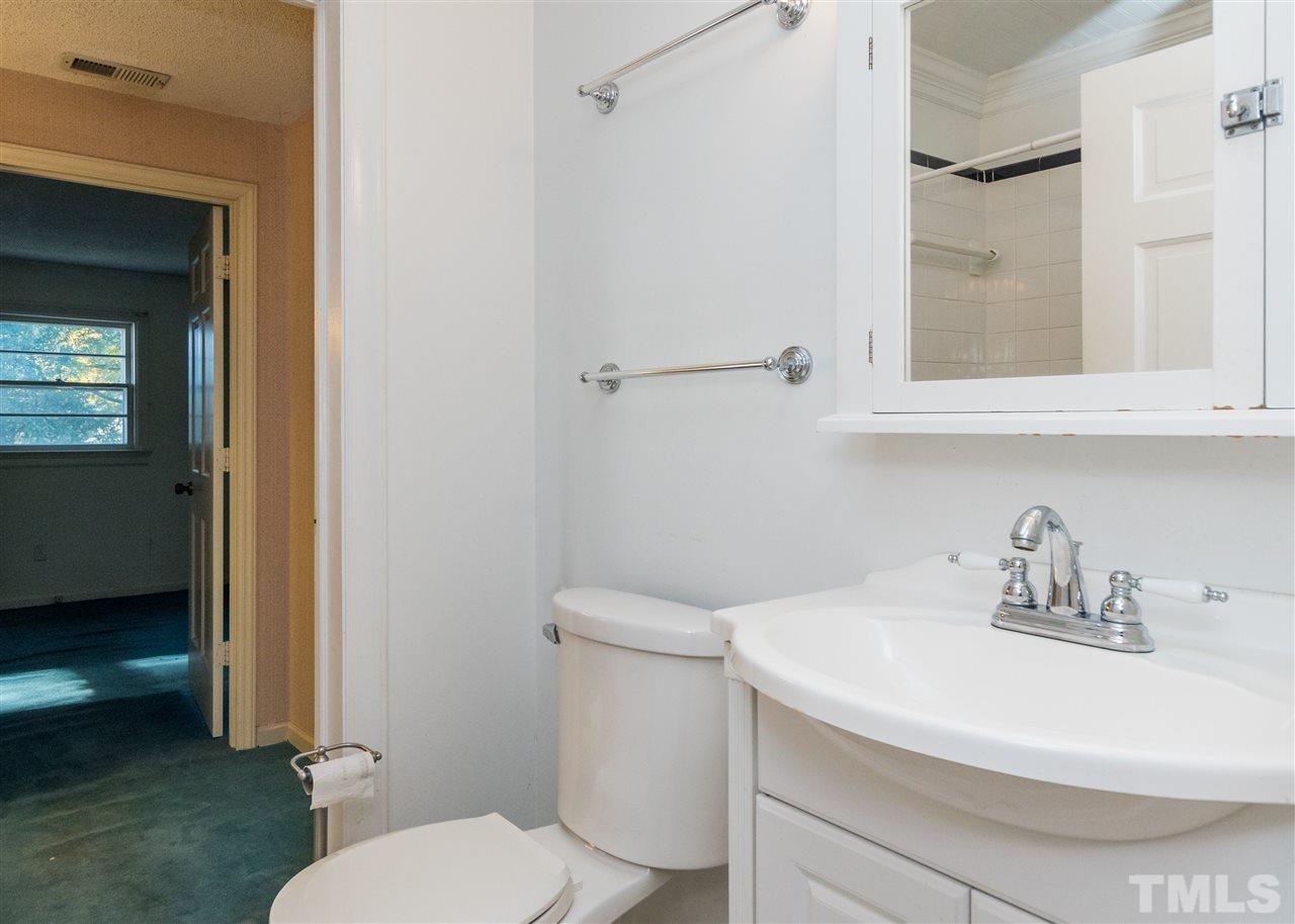 509 Burton Street Raleigh, NC 27608 - Photo 16 of 25 a bathroom with a sink and a toilet