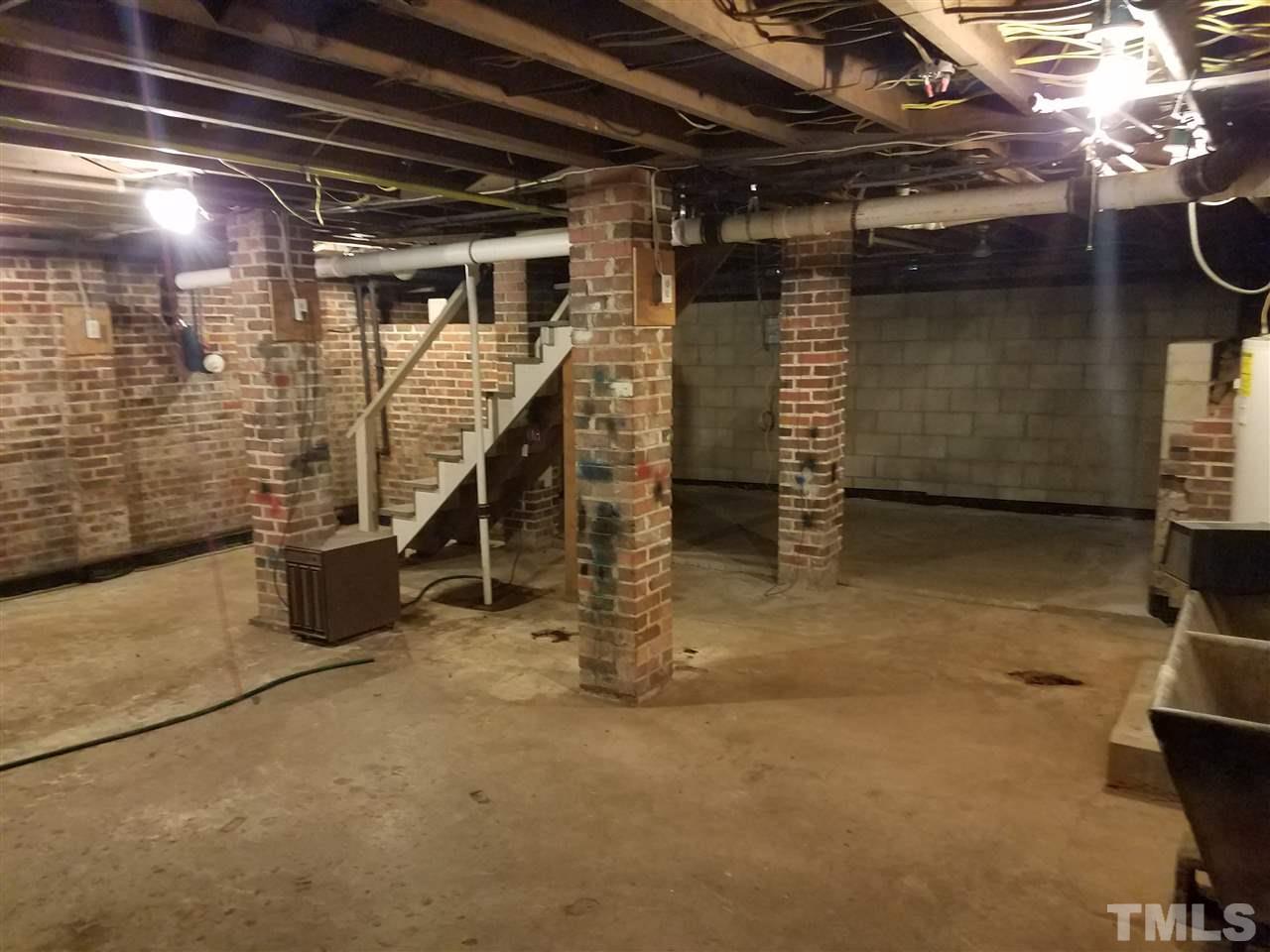 509 Burton Street Raleigh, NC 27608 - Photo 25 of 25 a view of an empty room with wooden walls