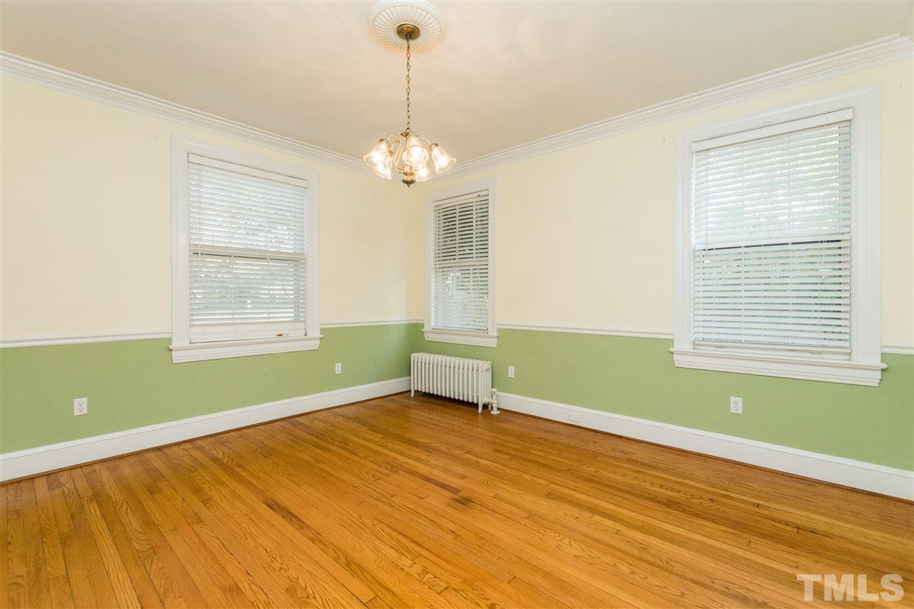 509 Burton Street Raleigh, NC 27608 - Photo 4 of 25 a room with a window and ceiling fan