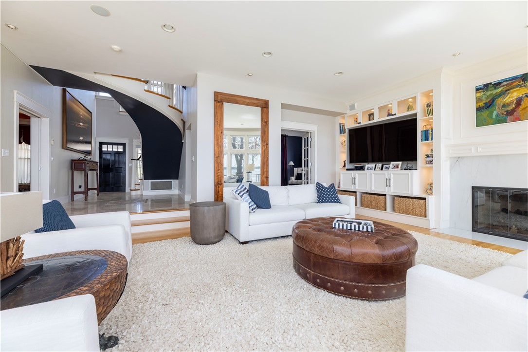 196 Channel View Warwick, RI 02889 - Photo 12 of 50 Gas fireplace, built ins with lighting.