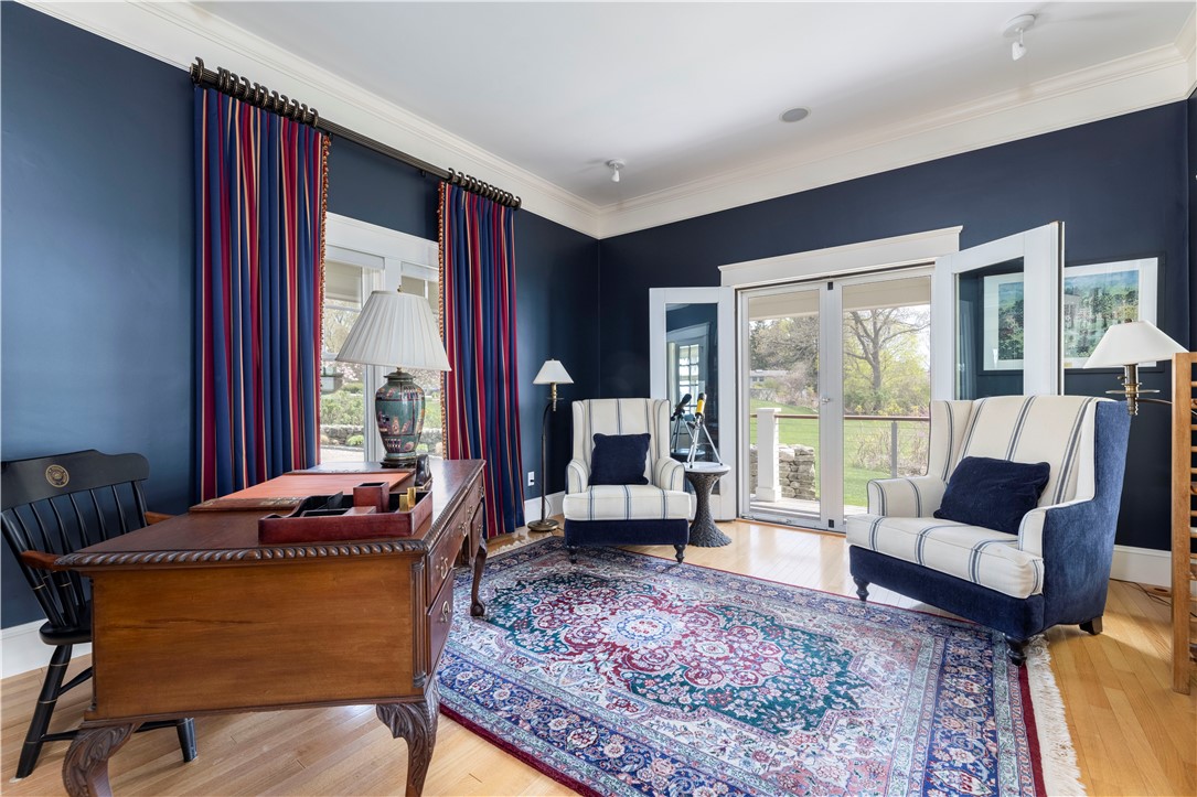 196 Channel View Warwick, RI 02889 - Photo 24 of 50 Impressive first floor office with access to mahogany deck. There is a possibility of converting to a first floor bedroom with full bath and closet.