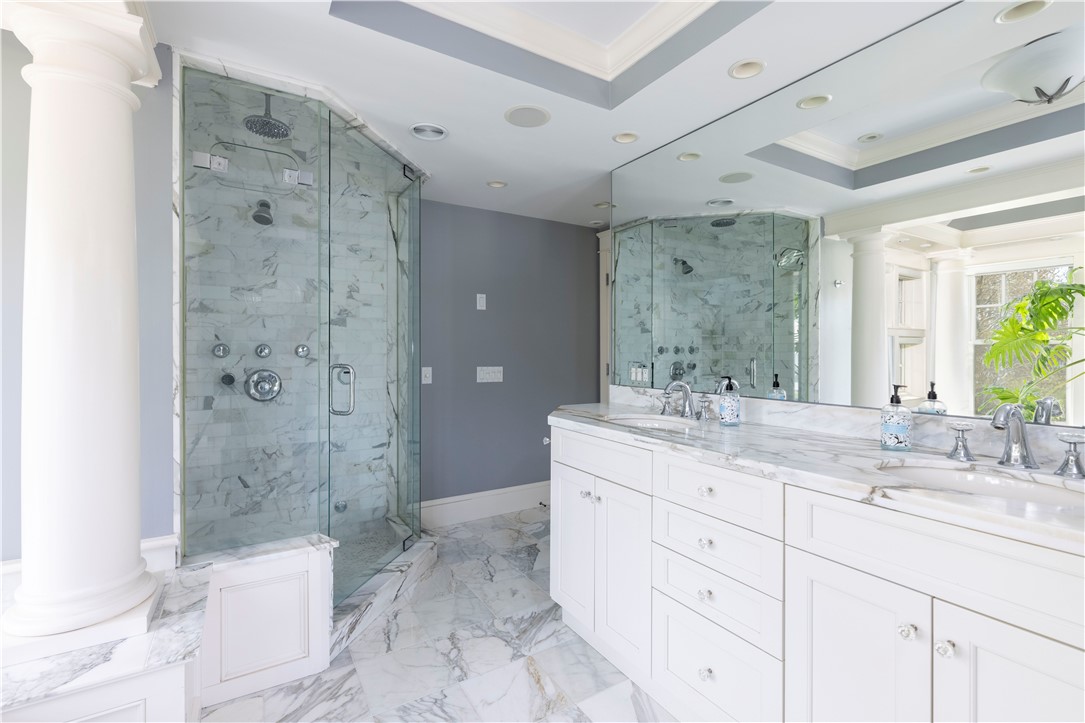 196 Channel View Warwick, RI 02889 - Photo 33 of 50 Walk in shower with multiple shower heads/jets, steam shower, Calcutta gold marble throughout, custom vanity.