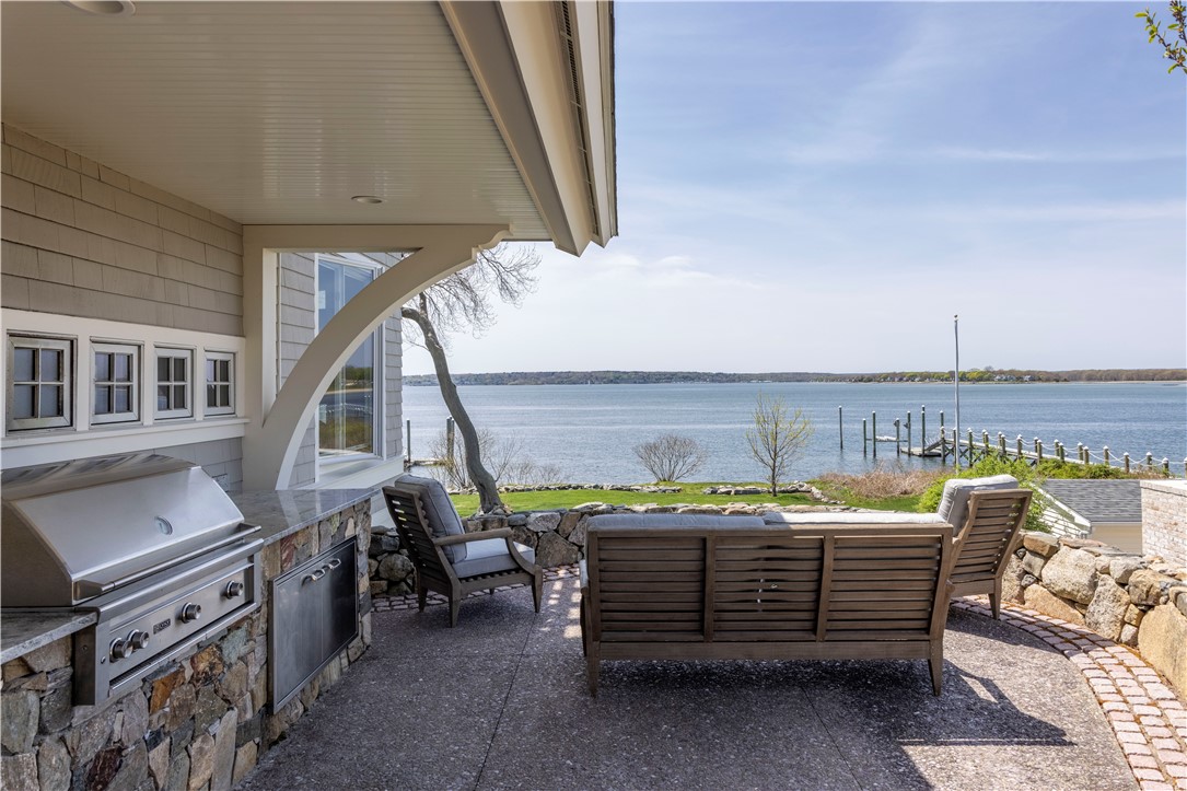 196 Channel View Warwick, RI 02889 - Photo 45 of 50 Large patio with built in Lynx grill and large granite outdoor serving kitchen. Direct access from kitchen.