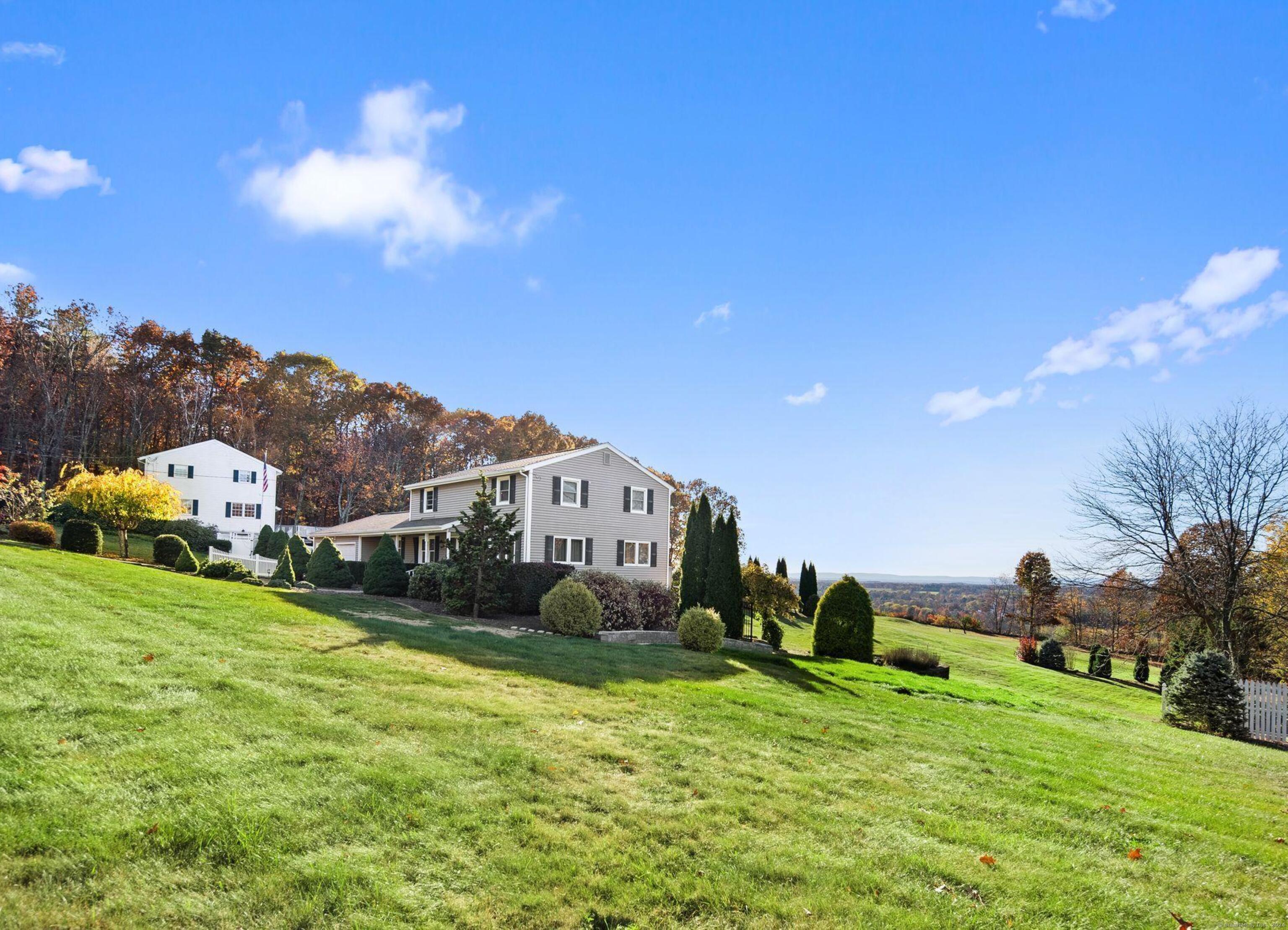 14 Virginia Drive Ellington, CT 06029 - Photo 1 of 1 a view of a house with a big yard and large trees