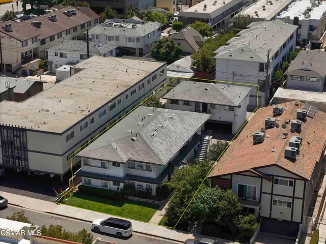 an aerial view of a house with a garden