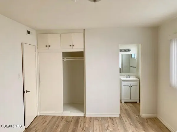 a view of a kitchen with wooden floor