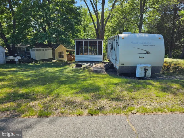 a house view with a sitting space and garden space