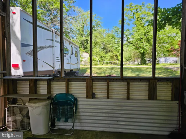 a view of a balcony with chairs
