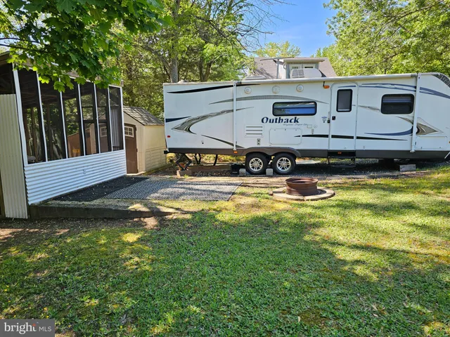a view of the house with backyard