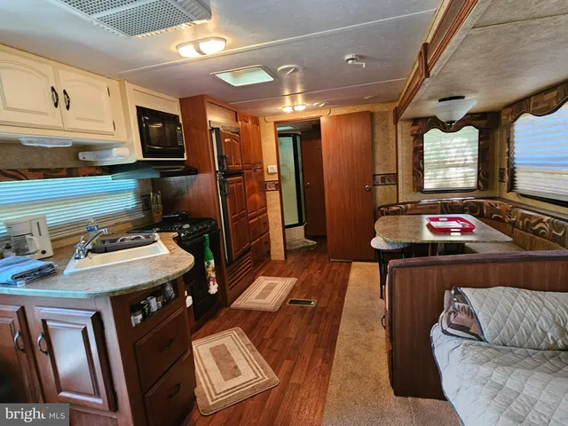 a living room with furniture and flat screen tv