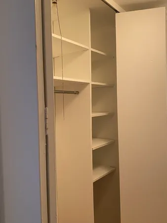 a view of an empty walk in closet