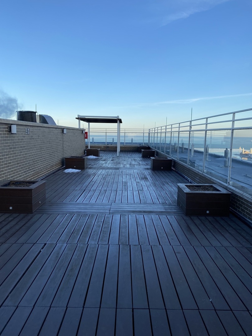 260 East Chestnut Street, Unit 708 Chicago, IL 60611 - Photo 10 of 12 a view of outdoor space with wooden floor