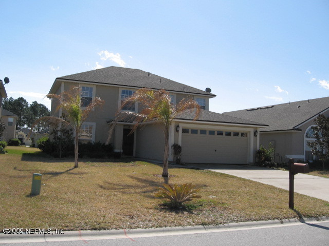 907 Silver Spring Court St. Augustine, FL 32092 - Photo 2 of 17 a front view of a house with garage