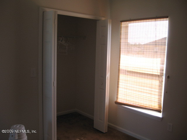 907 Silver Spring Court St. Augustine, FL 32092 - Photo 7 of 17 a view of an empty room with a window