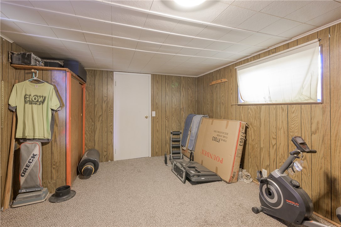 1798 Rio Grande Way Bullhead City, AZ 86442 - Photo 23 of 43 Workout room featuring wood walls and carpet floors