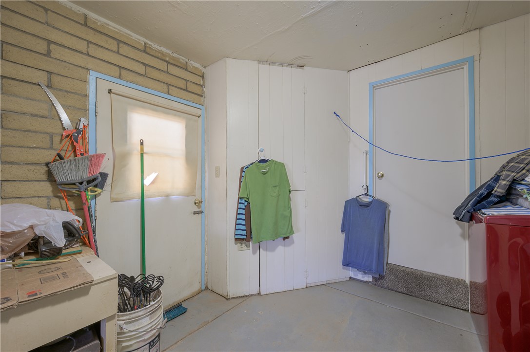 1798 Rio Grande Way Bullhead City, AZ 86442 - Photo 31 of 43 Miscellaneous room featuring wood walls and concrete floors