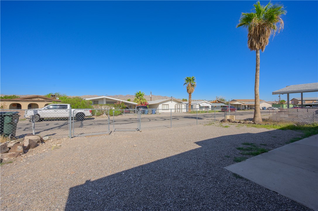 1798 Rio Grande Way Bullhead City, AZ 86442 - Photo 33 of 43 View of yard with a gate and a residential view