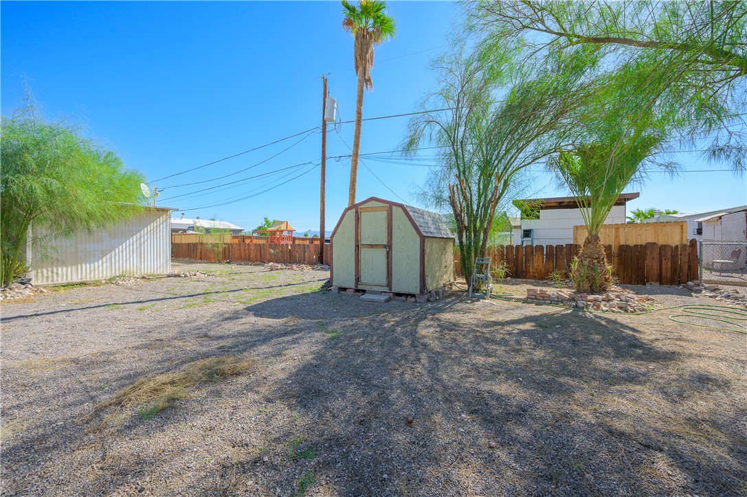 1798 Rio Grande Way Bullhead City, AZ 86442 - Photo 37 of 43 Fenced backyard featuring a storage shed