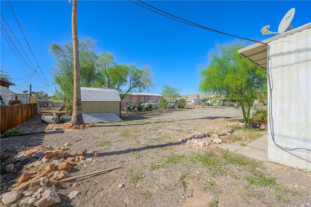1798 Rio Grande Way Bullhead City, AZ 86442 - Photo 40 of 43 Fenced backyard featuring a storage shed