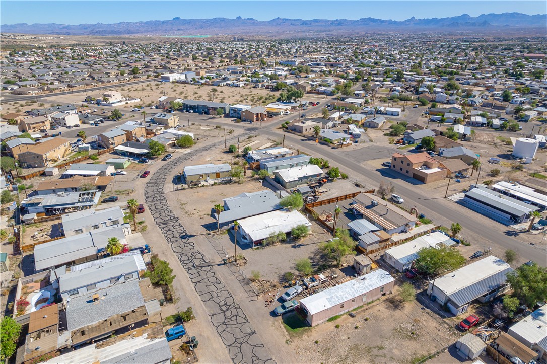 1798 Rio Grande Way Bullhead City, AZ 86442 - Photo 6 of 43 Aerial view of residential area with a mountain backdrop