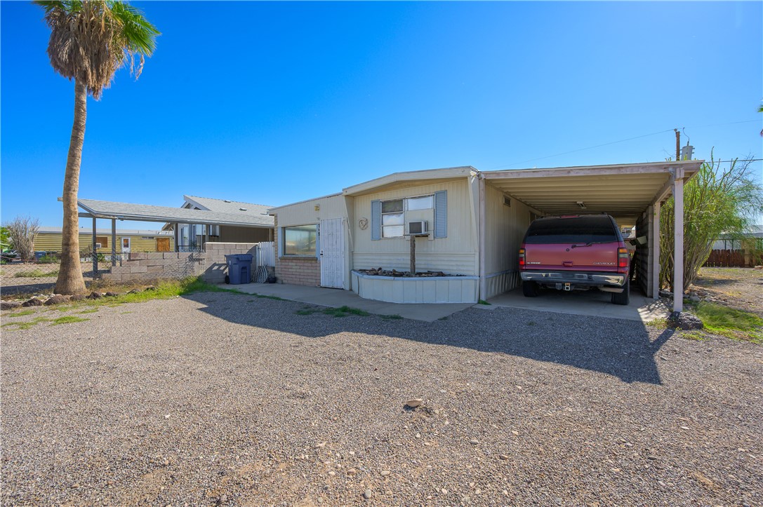 1798 Rio Grande Way Bullhead City, AZ 86442 - Photo 9 of 43 Manufactured / mobile home with a carport and driveway