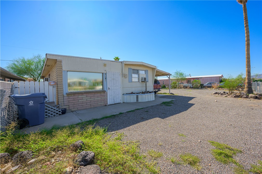 1798 Rio Grande Way Bullhead City, AZ 86442 - Photo 10 of 43 Rear view of property featuring a patio area and cooling unit
