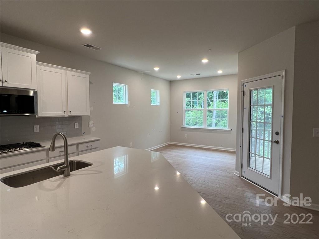 3159 Windhaven Lane, Unit 81 Tega Cay, SC 29708 - Photo 4 of 6 a view of a kitchen with electric appliances