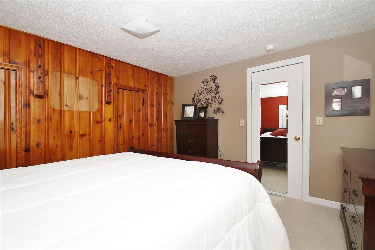 4825 Break Heart Road Crozet, VA 22932 - Photo 14 of 24 a large bed in a bedroom and a mirror