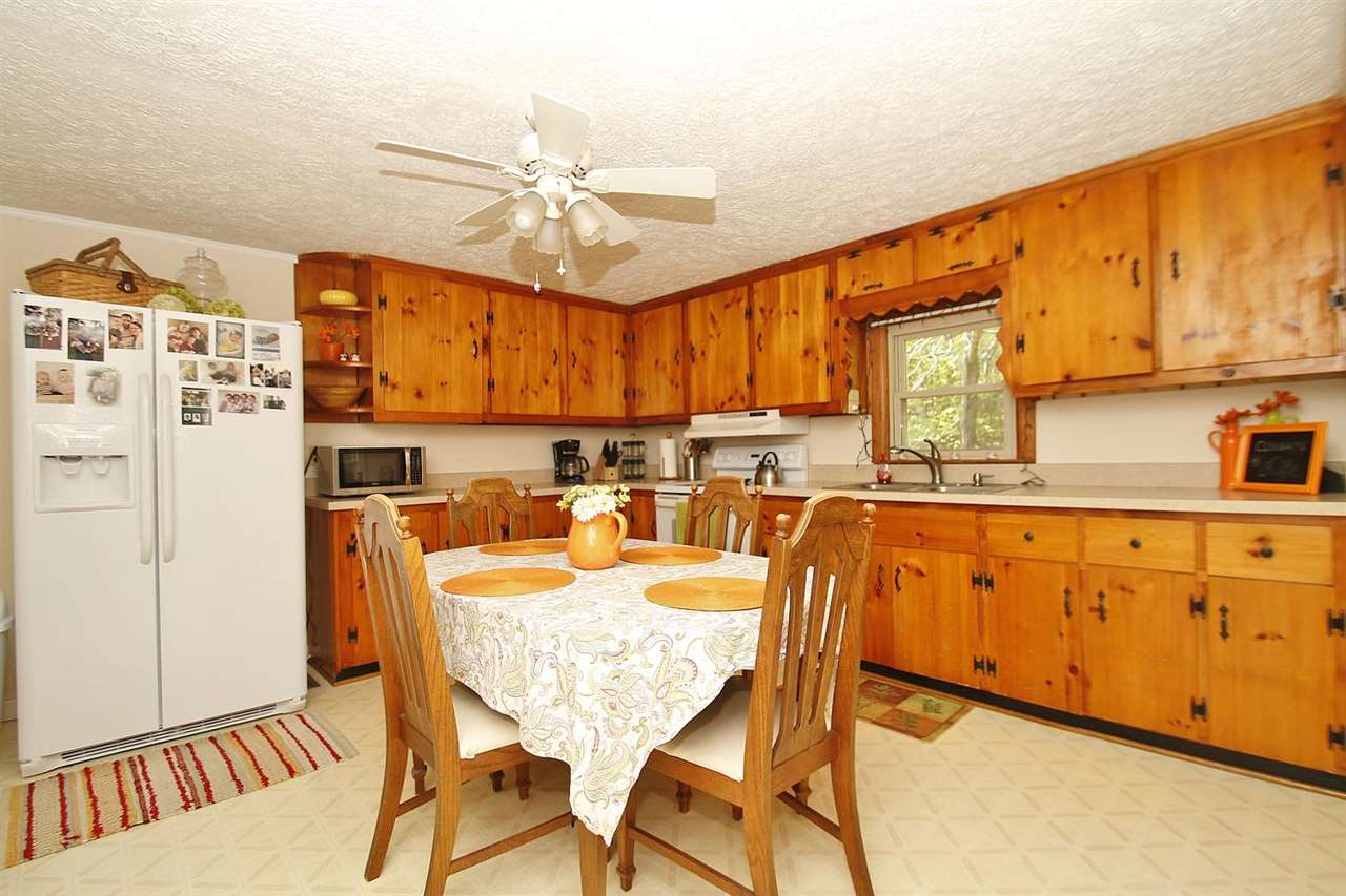 4825 Break Heart Road Crozet, VA 22932 - Photo 8 of 24 a dining table chair next to a window with kitchen view