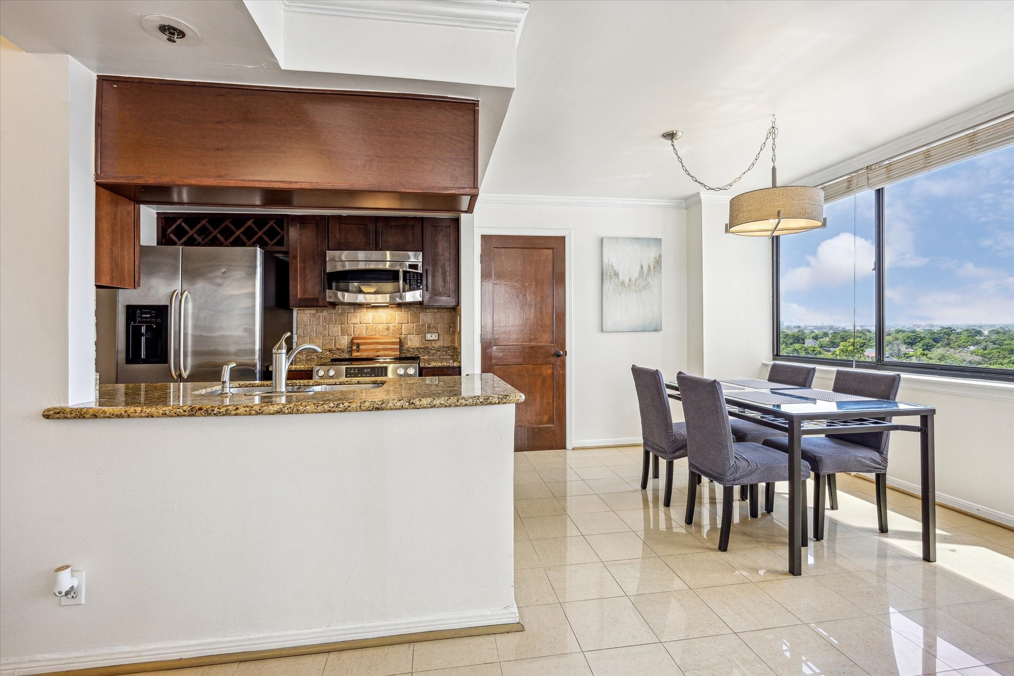 3525 Sage Road, Unit 1010 Houston, TX 77056 - Photo 11 of 34 The kitchen offers generous counter space and flows effortlessly into the dining area.