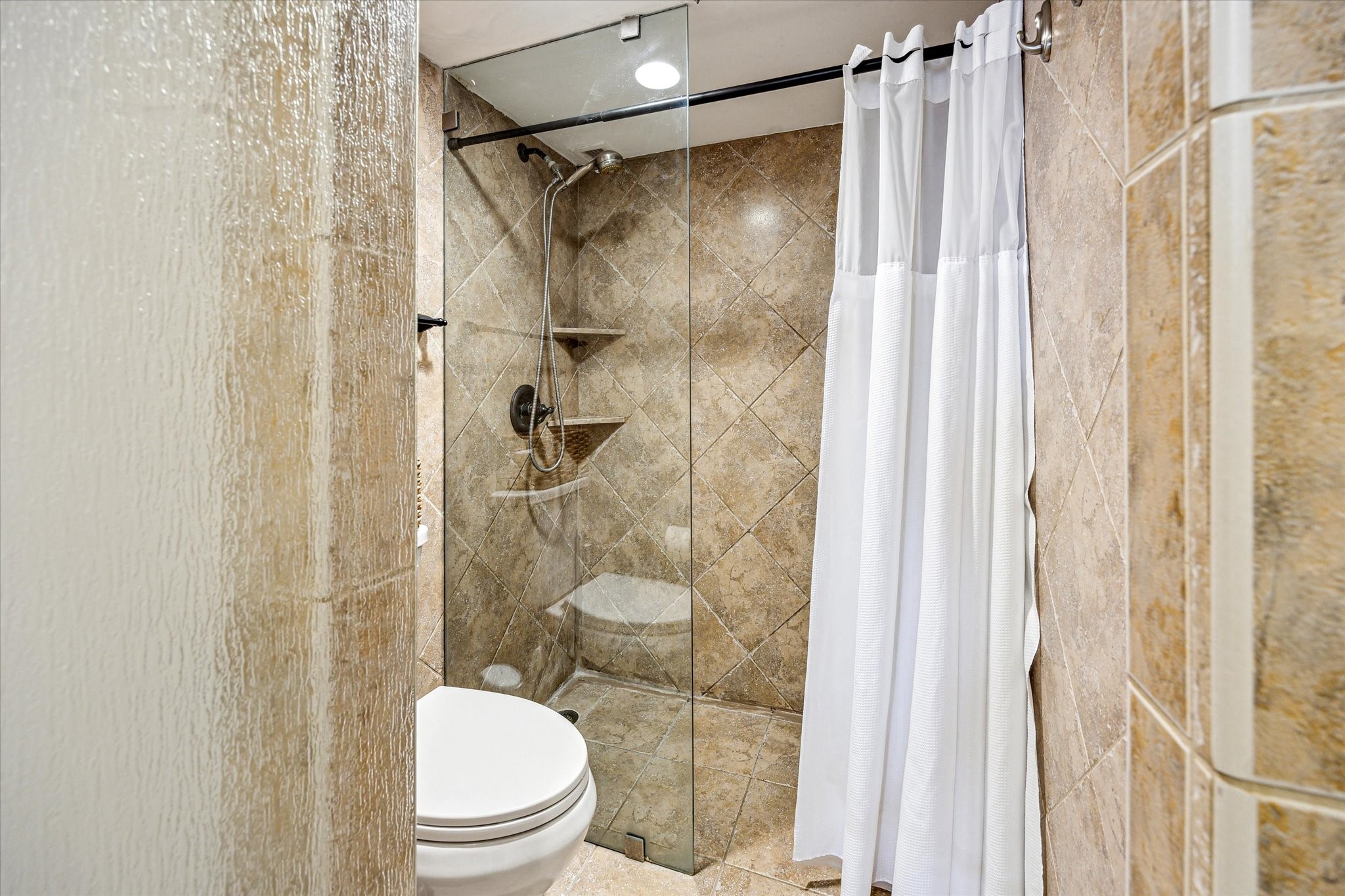 3525 Sage Road, Unit 1010 Houston, TX 77056 - Photo 23 of 34 Primary bathroom features a frameless glass door that leads into the walk-in shower.