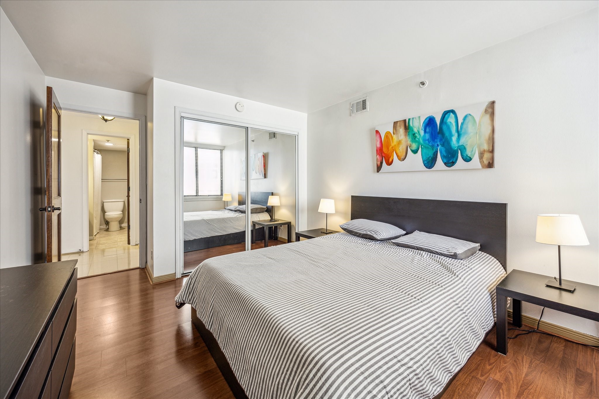 3525 Sage Road, Unit 1010 Houston, TX 77056 - Photo 25 of 34 This bedroom features a spacious closet with full-length mirrors.