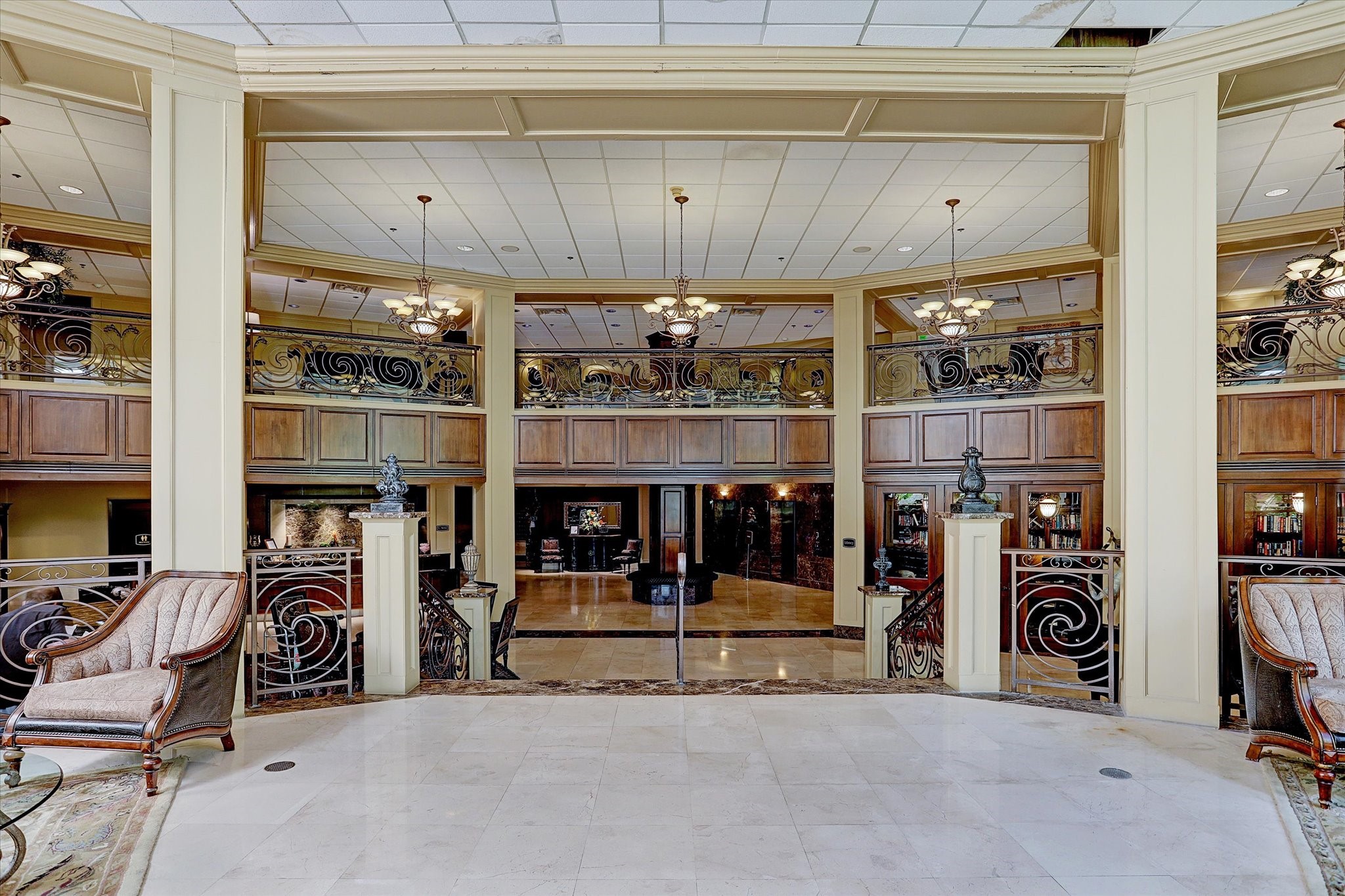 3525 Sage Road, Unit 1010 Houston, TX 77056 - Photo 29 of 34 Fob-secured lobby entry leads to a lounge area, 24/7 concierge, library, work space, gym, and pool access.