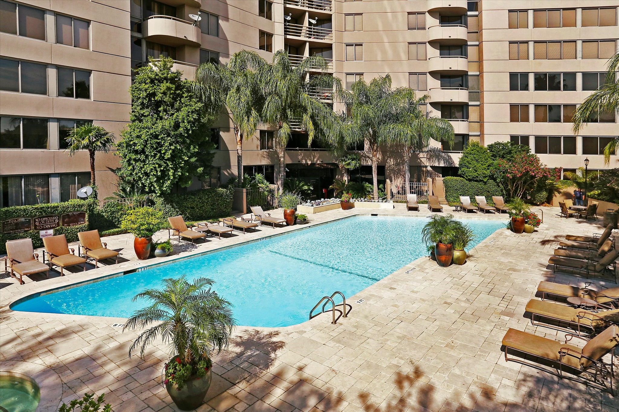 3525 Sage Road, Unit 1010 Houston, TX 77056 - Photo 32 of 34 Relax by the pool and hot tub, complete with a cabana, built-in BBQ grill, and plenty of outdoor seating.