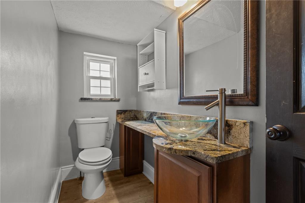 41 Bethlehem Street Fredericktown, PA 15333 - Photo 18 of 33 a view of a bathroom with a sink and a toilet