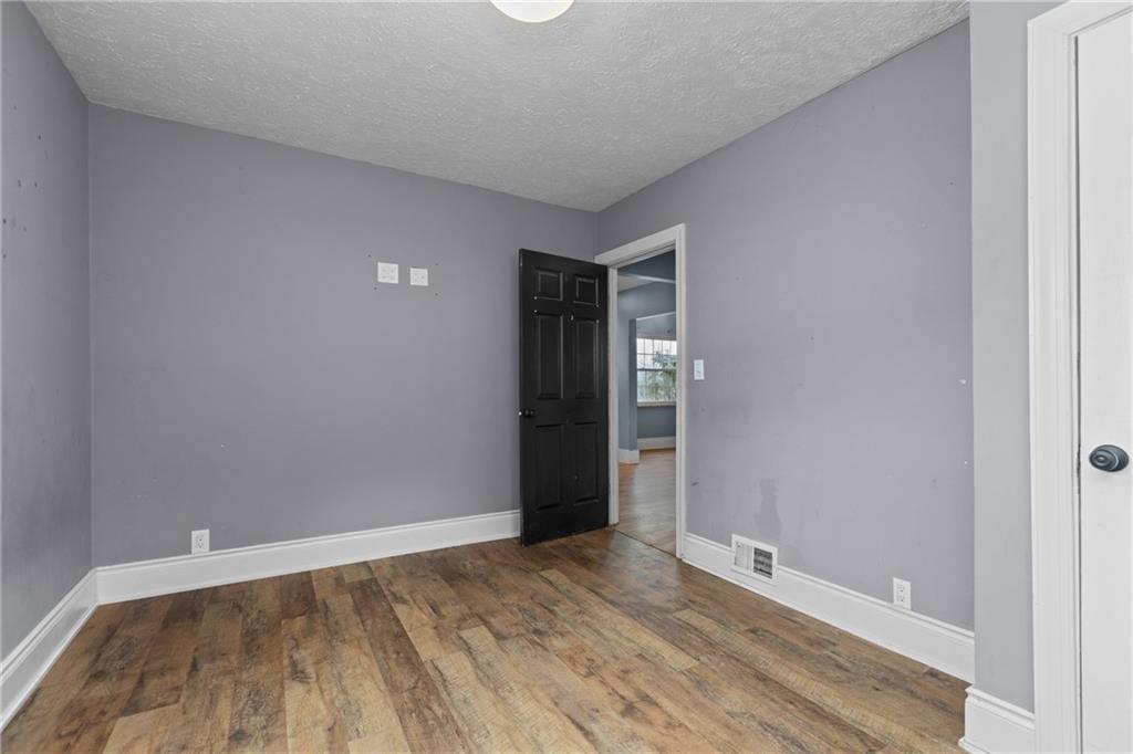 41 Bethlehem Street Fredericktown, PA 15333 - Photo 20 of 33 a view of an empty room with wooden floor and closet