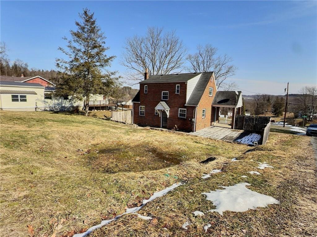 41 Bethlehem Street Fredericktown, PA 15333 - Photo 30 of 33 a view of a backyard with large trees
