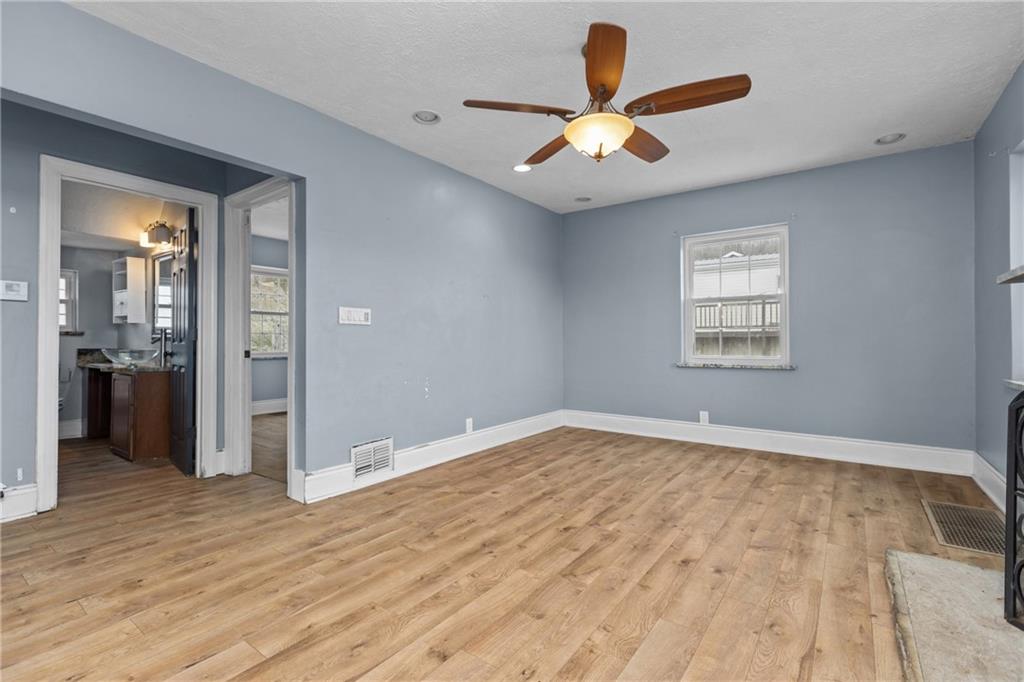 41 Bethlehem Street Fredericktown, PA 15333 - Photo 8 of 33 wooden floor in an empty room with a window