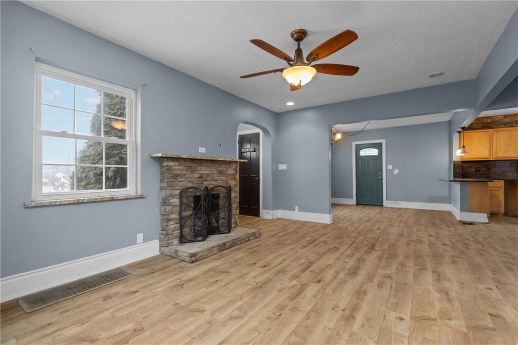 41 Bethlehem Street Fredericktown, PA 15333 - Photo 10 of 33 a view of a livingroom with a fireplace and window
