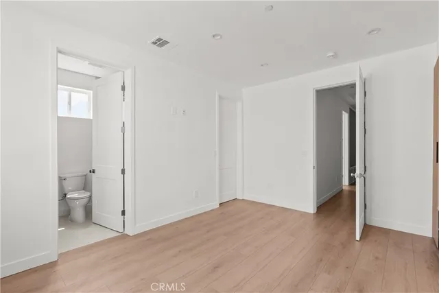 a bathroom with a bathtub a mirror a vanity and a shower