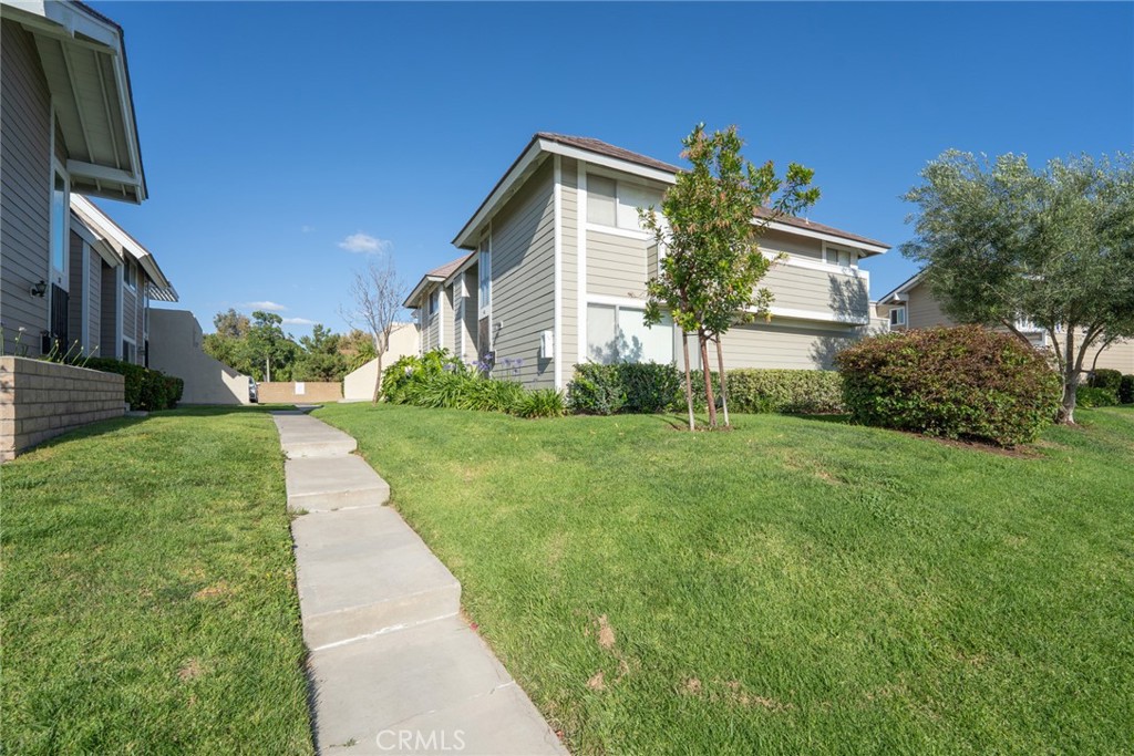 45 Oval Irvine, CA 92604 - Photo 32 of 40 a front view of house with yard and green space