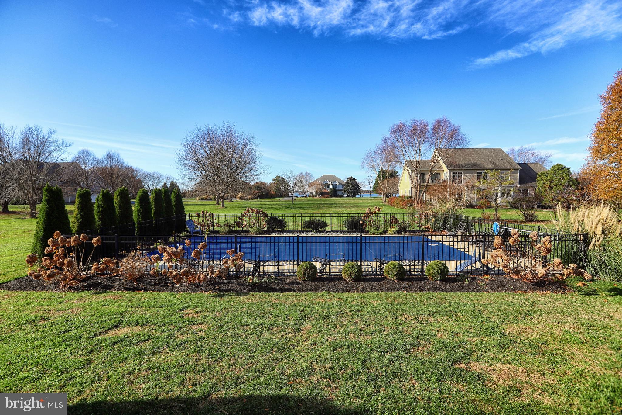 2902 Cox Neck Road East Chester, MD 21619 - Photo 51 of 57 a view of a yard with a table and chairs