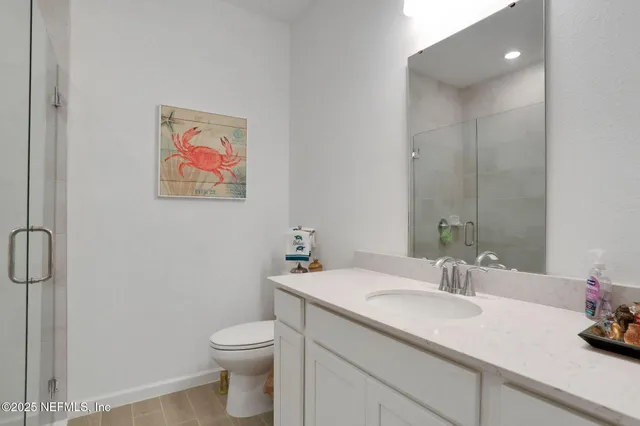 a view of a field with trees in the background